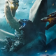 Godzilla and Ghidorah square off in a King of the Monsters poster.